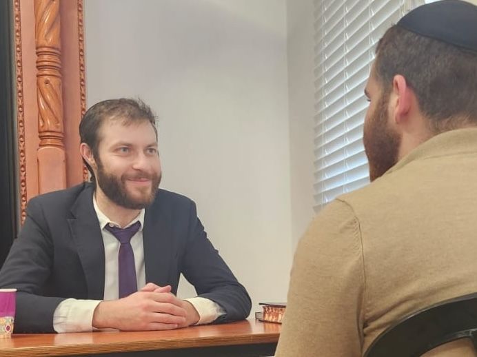 Rav Isaac having a meal with friends